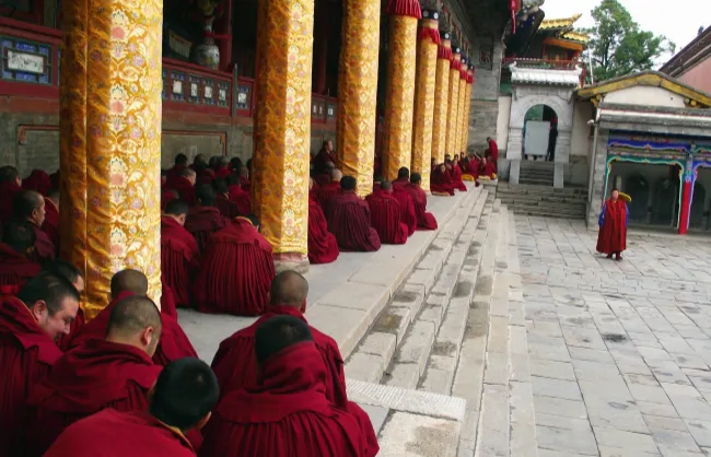 Monks debating Buddhist scripture in Kumbum Monastery